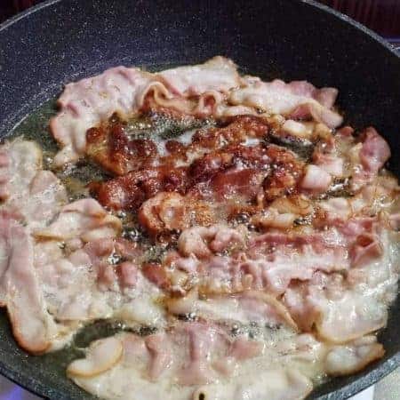 frying bacon on frying pan video clip