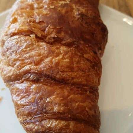croissant on a plate tilt stock video clip