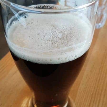 glass of dark ale stock video clip