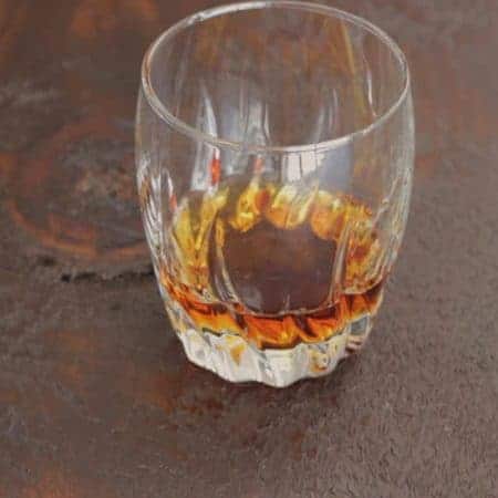 glass of whiskey tilt stock video clip