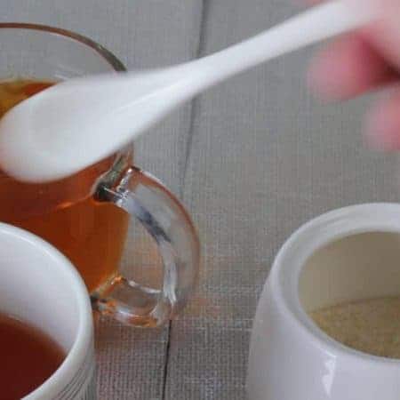 sugar in white tea cup drinks video